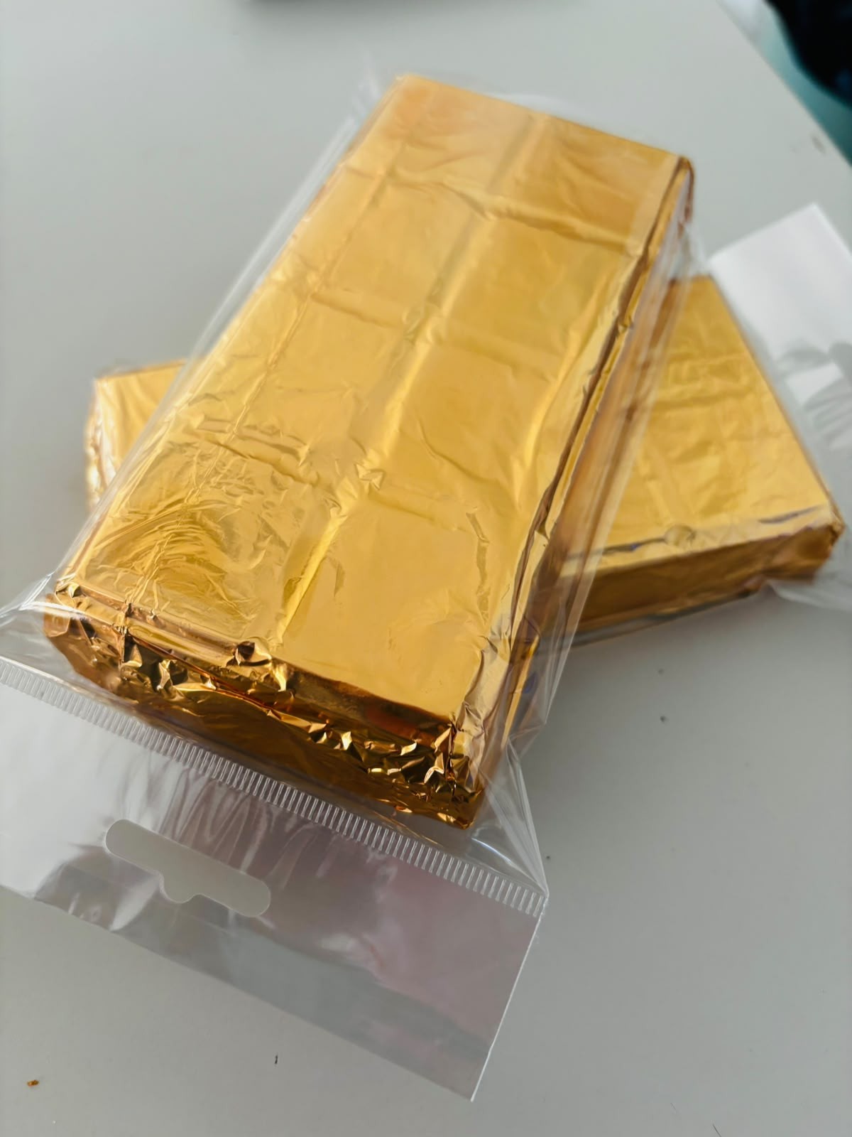 Gold foil, then a cellophane wrapper. How every slab leaves Durbanville.